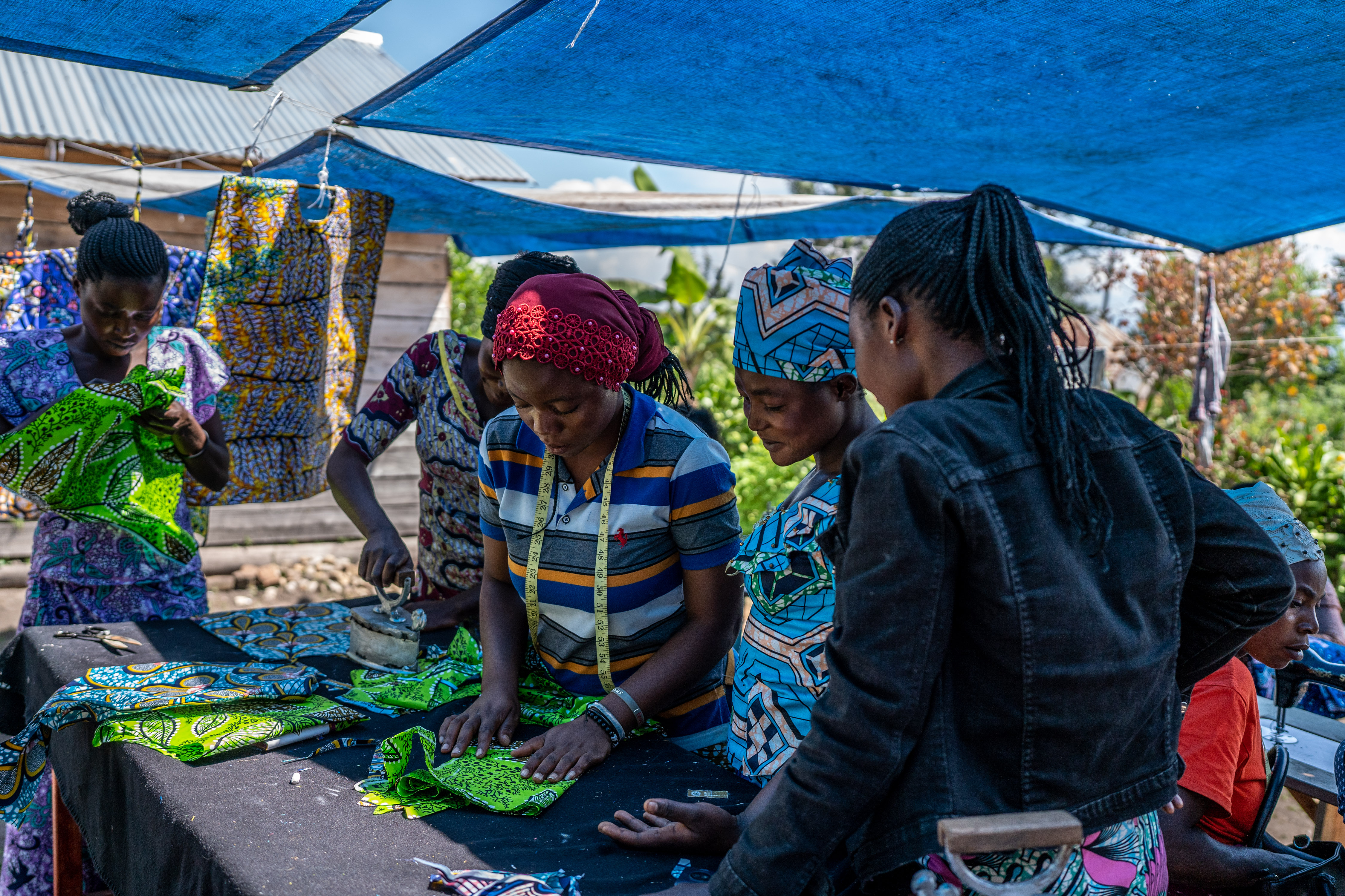 Women's workshop teaching them how to sew.