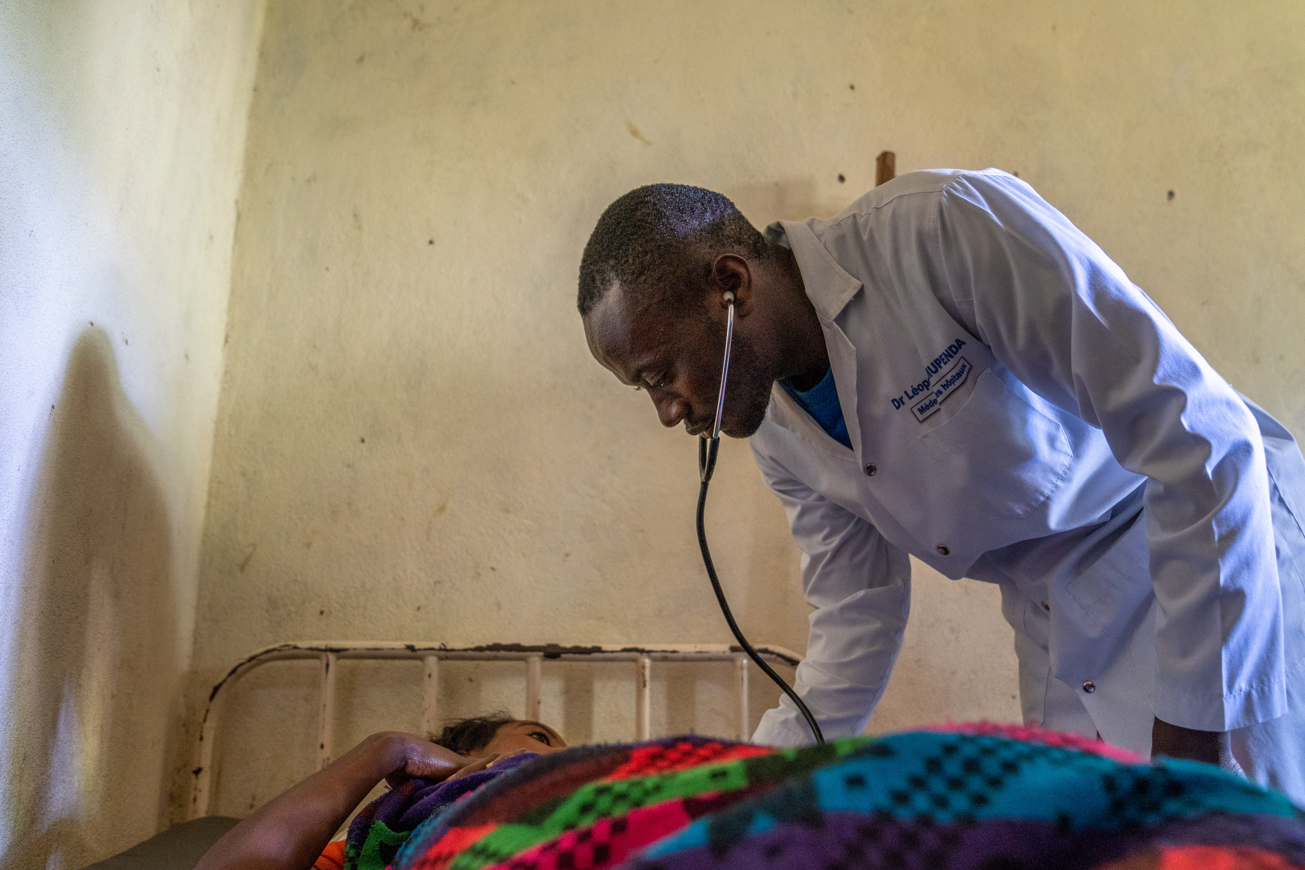 Doctor taking care of a patient.