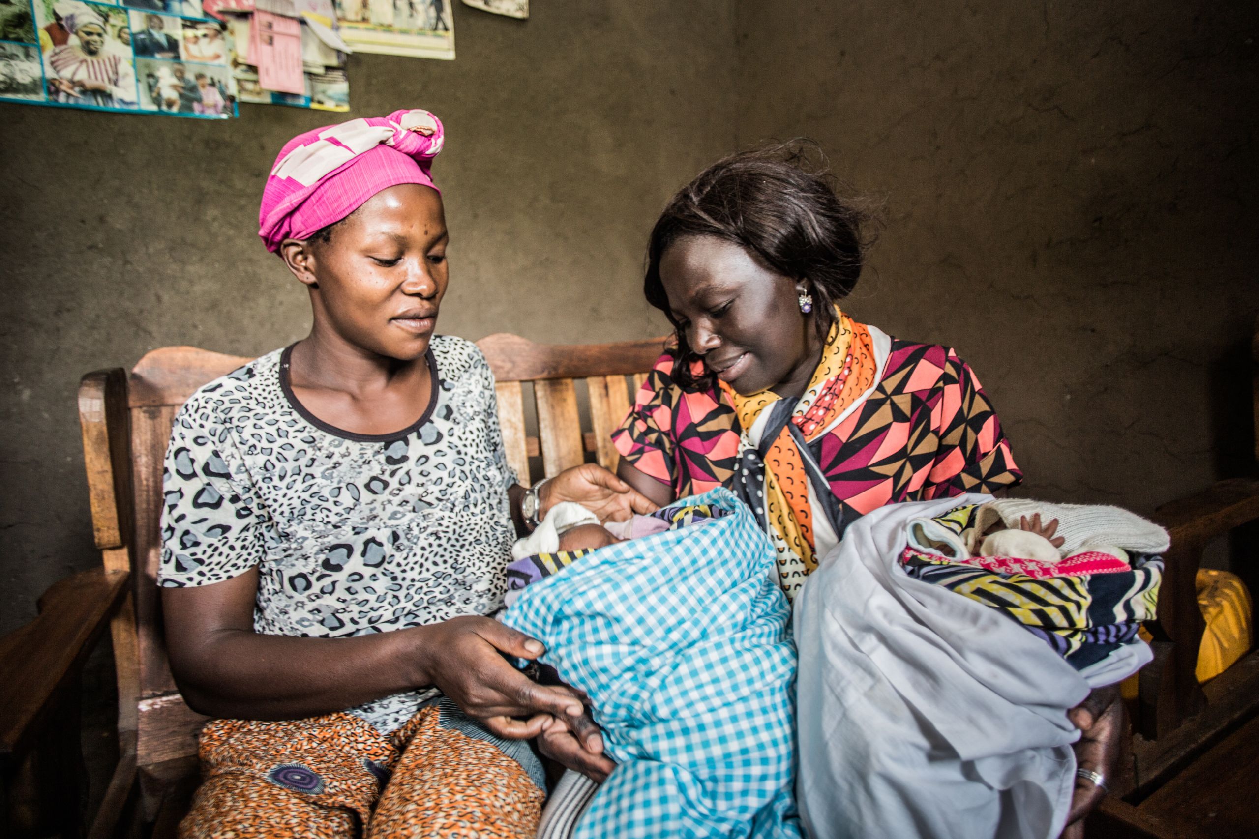 Assisting mothers with their newborn babies.