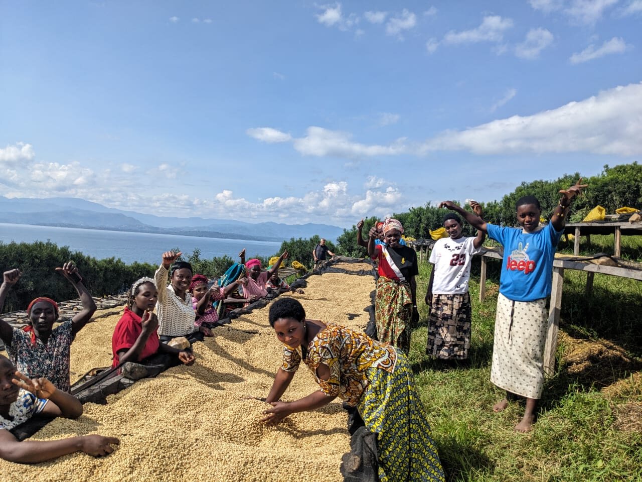 Members of the cooperative at the coffee drying beds above Lake Kivu.