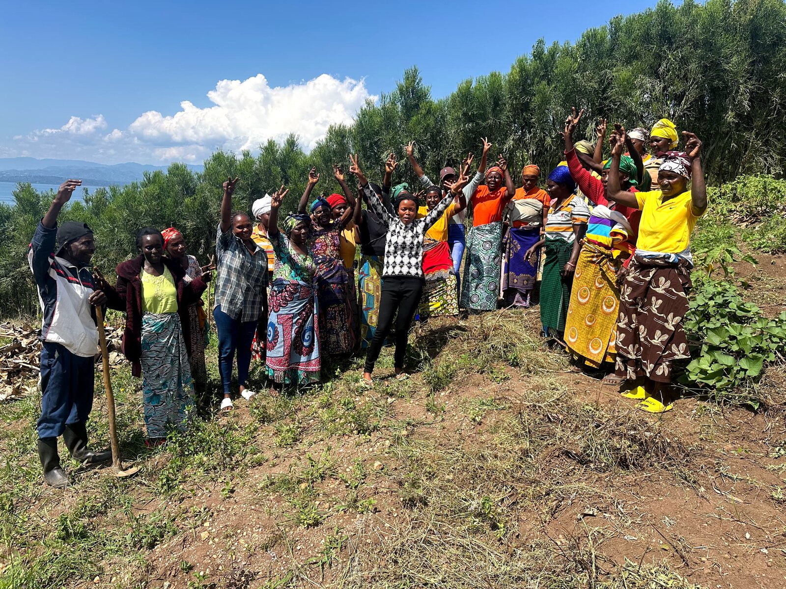Members of the cooperative on a hillside above the lake.